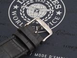 a watch that is laying on top of a piece of paper