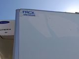 a white refrigerator with a freezer on top of it
