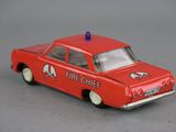 a red toy car with a blue light on top of it
