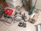 a lot of assorted items on the floor in the room