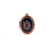 an image of a picture of a ring with a red stone in it