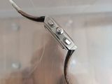 a close up of a wire with a button on it