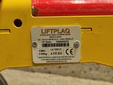 a close up of a label on a yellow machine