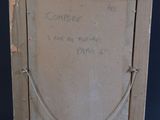 an old picture frame with a message written on it on a black background