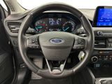 a steering wheel and dashboard of a car with a touch screen