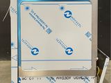 a white box with a blue ribbon on top of it