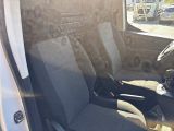 two seats in the back of a van with a cup of coffee