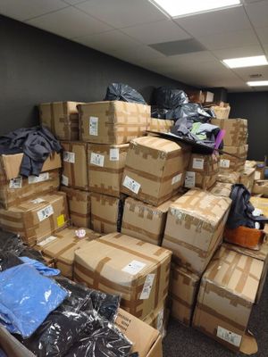 a large pile of boxes sitting in a room