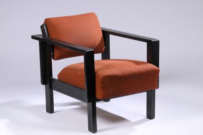 an image of a chair with an orange upholstered seat on a white background