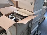 a pile of boxes and boxes on a pallet in a warehouse