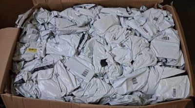 a cardboard box filled with many different types of electronic devices