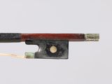 an old violin bow with a wooden handle on a white background