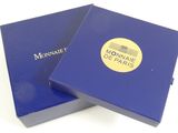 the box is blue and has a gold logo on it