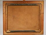 an old wooden easel with a chalk board on top of it