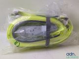 a yellow cord that is wrapped in plastic on a table