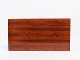 an image of a wooden cutting board on a white background