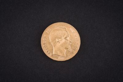 a gold coin on a black background