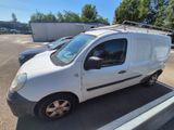 a small white van parked in a parking lot