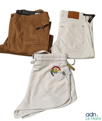 three pairs of men ' s pants with a rainbow patch on them