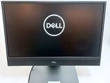 a close up of a dell computer monitor on a table