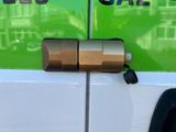 a close up of a car door handle on the side of a van