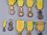 many medals and medals on display on a wall
