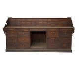 an old wooden desk with drawers and drawers underneath it