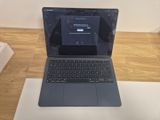 a laptop computer sitting on top of a table