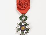 an image of a red ribbon with a star on top of it