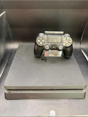 a video game controller sitting on top of a metal box