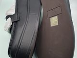 men ' s black leather slippers with a rubber sole and a rubber sole
