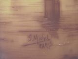 a brown vase with writing on it sitting on a table
