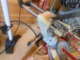 a machine that is sitting on the floor next to a chair