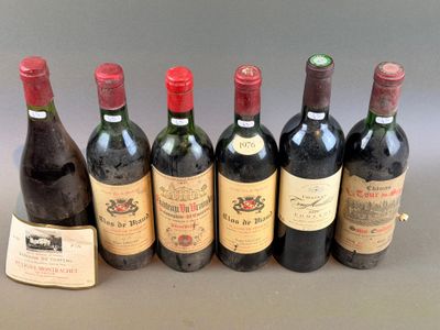 six bottles of wine are lined up in a row on a table