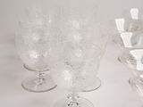 a lot of empty wine glasses on the table