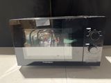 a microwave that is sitting on a counter top