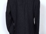 the back of a black jacket on a mannequin mannequin mannequin mannequin mann