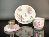 a small cup and saucer sitting on a table