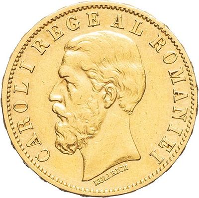 a close up of a gold coin with a man ' s face on it