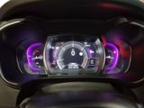 the dashboard of a motorcycle with a digital display in the center of it