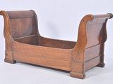 a wooden bench with a sleigh on top of it