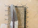 a pair of scissors sitting on top of a piece of paper