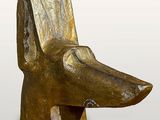 sculpture of a dog ' s head made of gold foil