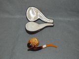 a picture of a pipe and a cigarette holder