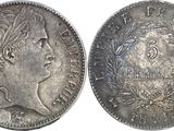 a close up of a coin with a woman ' s face on it