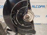 a close up of a metal object on a table near a wall