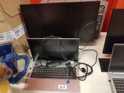 three laptops that are sitting on a table
