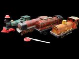 a toy train that is sitting next to other toy trains