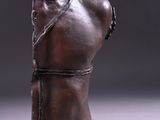 an image of a sculpture of a torso on a white surface