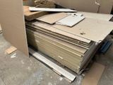 a pile of cardboard sitting on top of a pile of cardboard